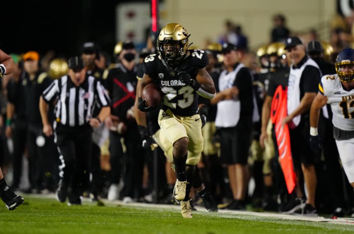 Colorado running back Jarek Broussard (23) runs down the sideline for a big gain.